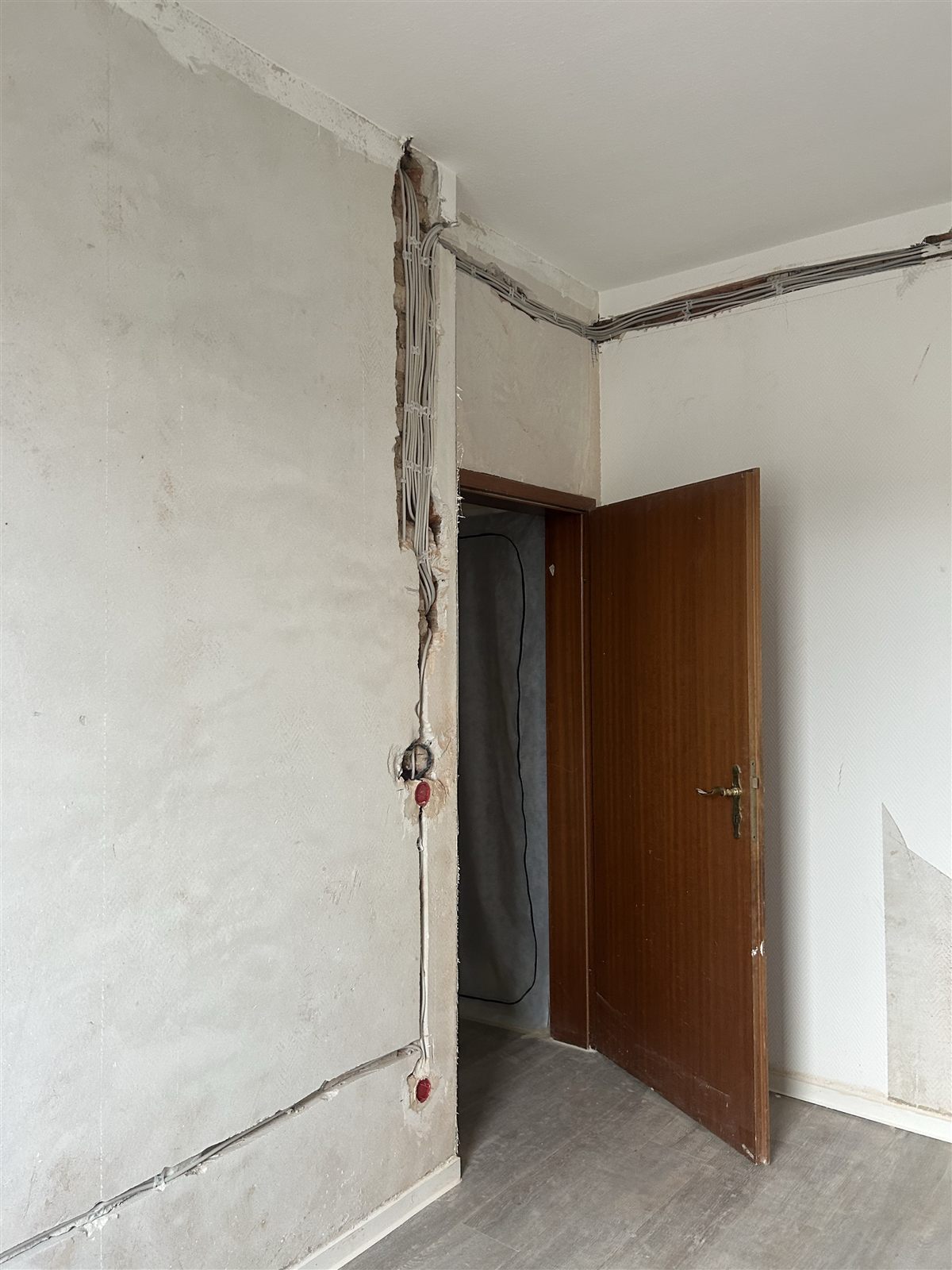 New service routes around the door and wall